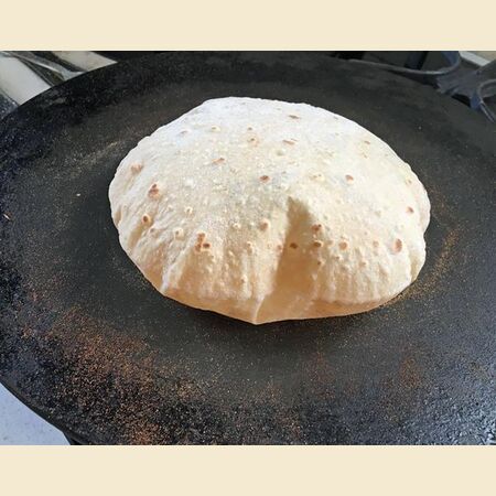 Chapati, Roti or Phulka (Indian Flatbread)  Cooked on a Tava or Pan