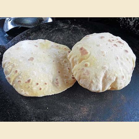 Chapati, Roti or Phulka (Indian Flatbread)  Cooked on a Tava or Pan