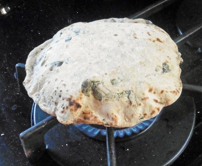 Chapati, Roti or Phulka (Indian Flatbread) with Wild Garlic Leaves  - picture
