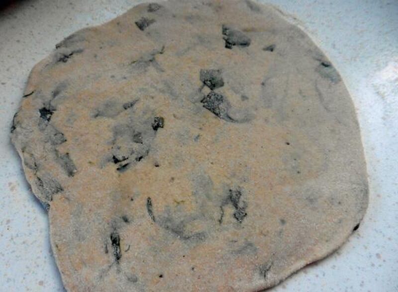 Chapati, Roti or Phulka (Indian Flatbread) with Wild Garlic Leaves  - picture
