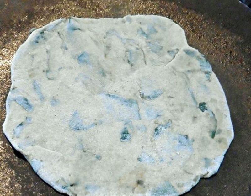 Chapati, Roti or Phulka (Indian Flatbread) with Wild Garlic Leaves  - picture