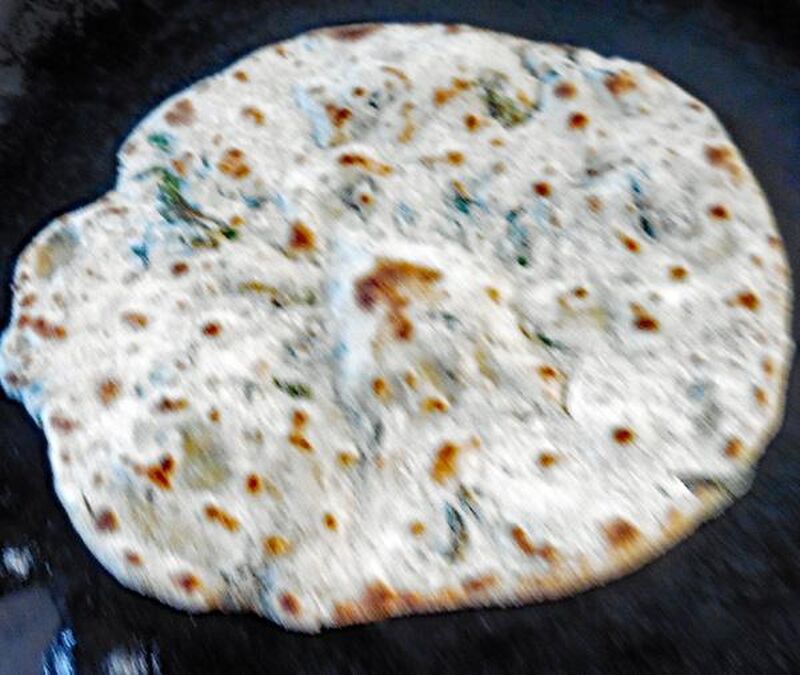 Chapati, Roti or Phulka (Indian Flatbread) with Wild Garlic Leaves  - picture